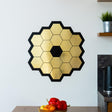 Gold chrome vinyl wall sticker of James Webb Space Telescope mirrors, ideal for space-themed room decor.