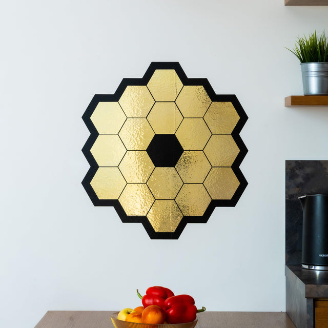 Gold chrome vinyl wall sticker of James Webb Space Telescope mirrors, ideal for space-themed room decor.