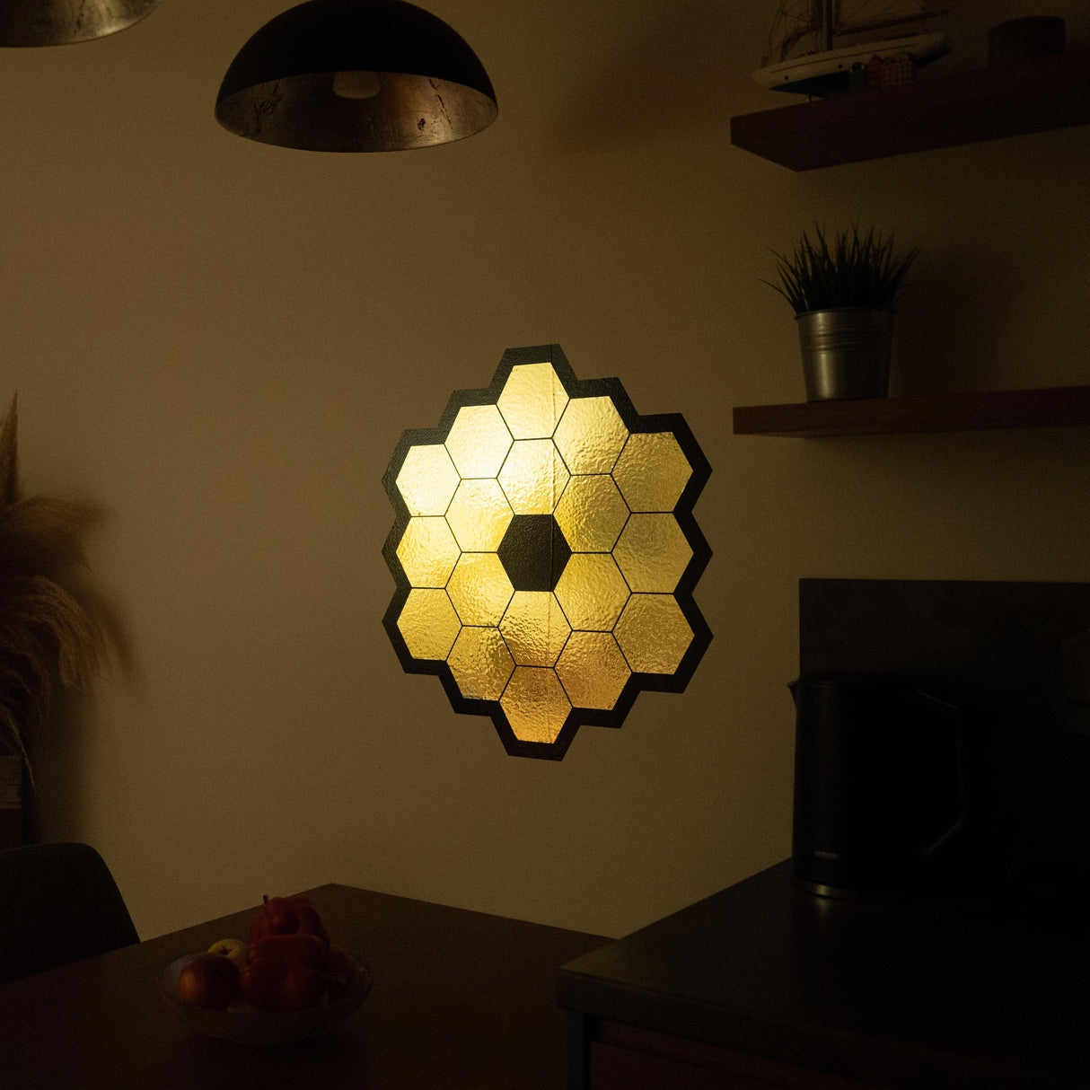 James Webb Space Telescope mirror wall sticker in gold chrome vinyl, adding elegance to a cozy space-themed decor.