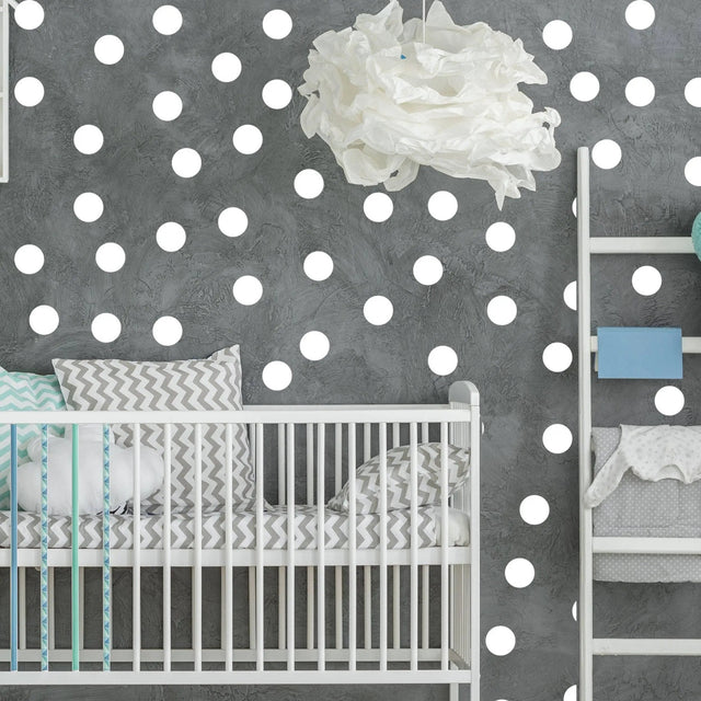 White round circle dot stickers on a nursery wall, creating a cozy and creative decorative atmosphere.
