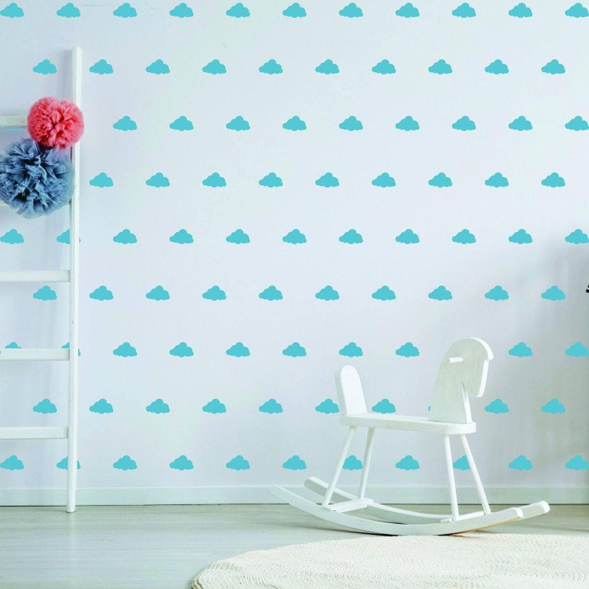 WhimsiCloud children's wall stickers featuring cute blue cloud designs on a nursery wall with a rocking horse.