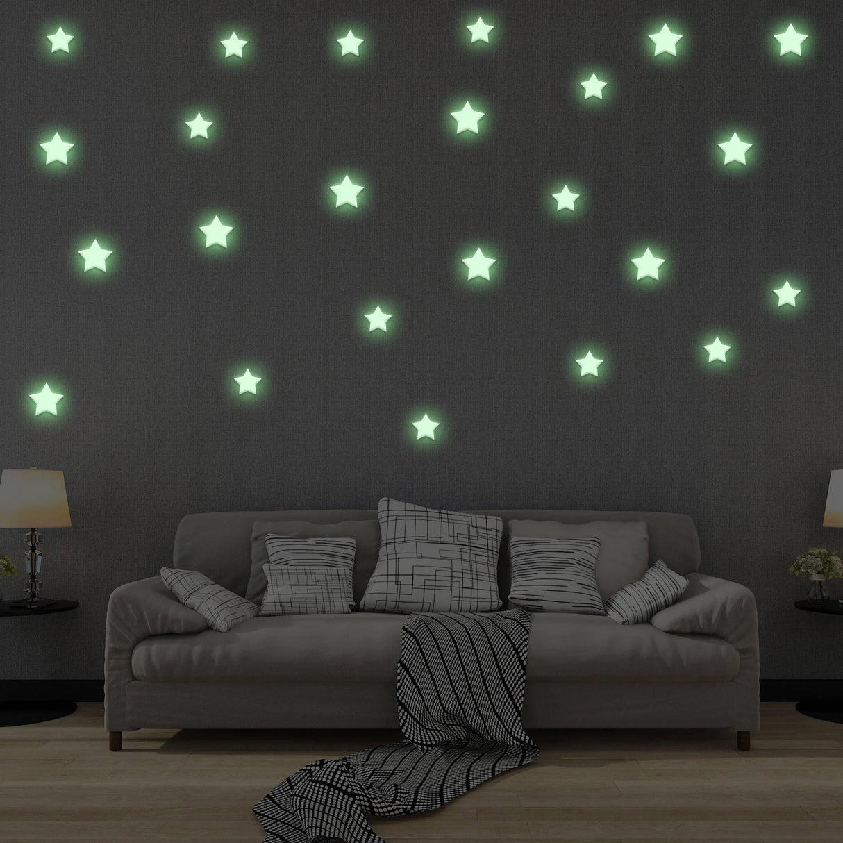 Glow in the dark star stickers on a wall above a cozy sofa, creating a magical starry atmosphere.