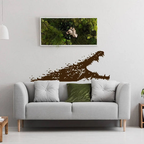 Adventure-themed wall vinyl sticker of a crocodile, adding unique decor above a stylish couch in a cozy living room.