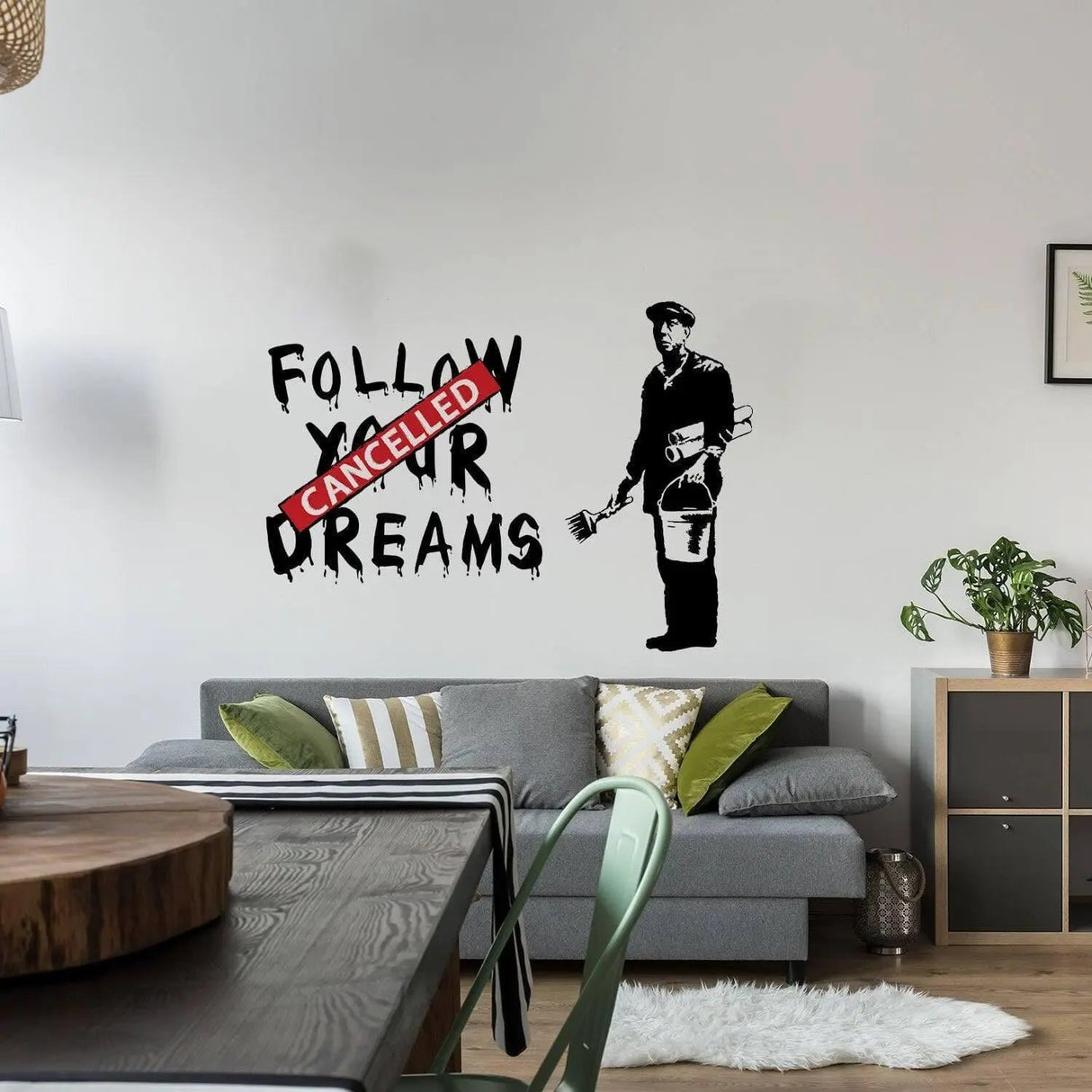 Urban Dreams Wall Decal with 'Cancelled' overlay, adding striking street art to modern living room decor.