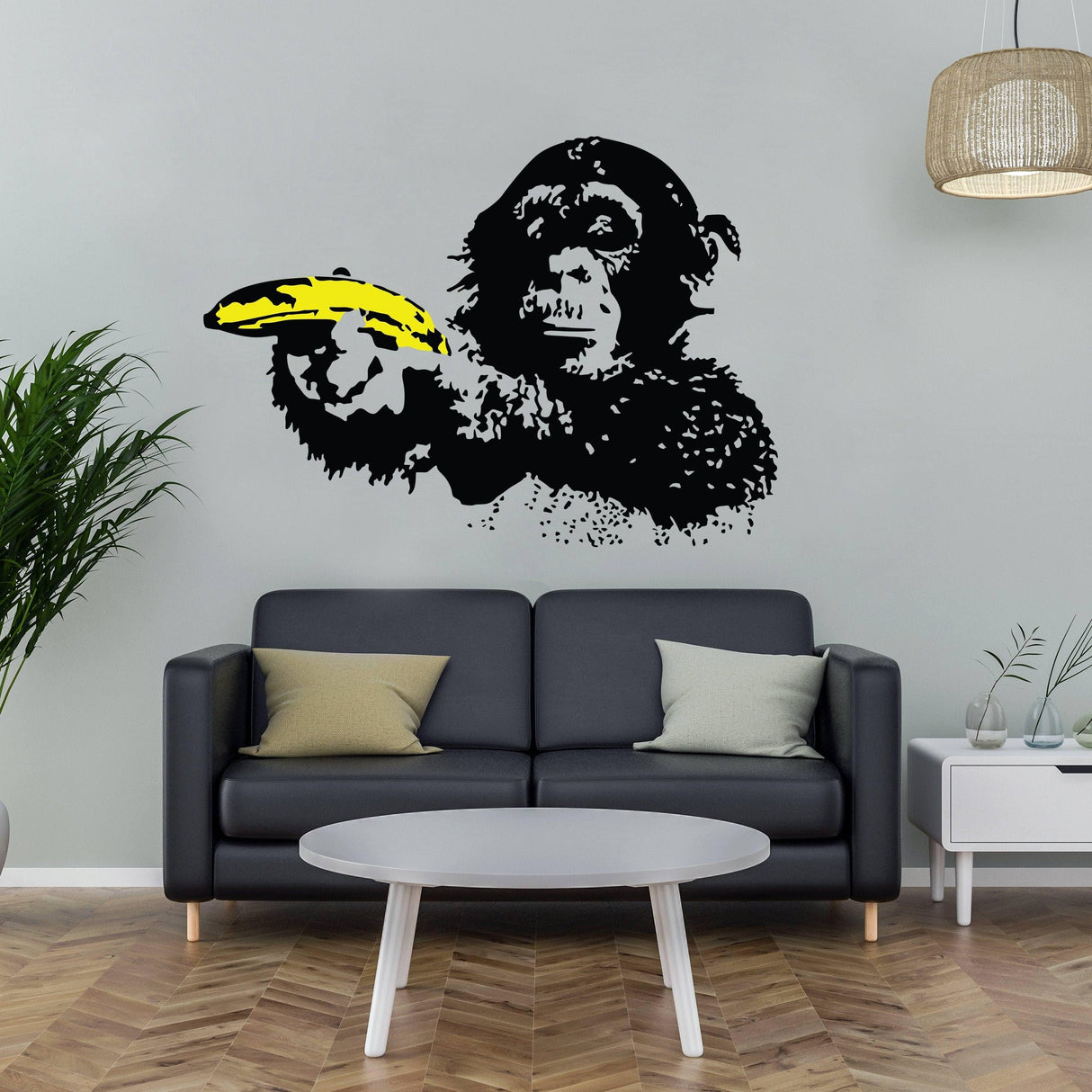 Vibrant Banksy monkey wall decal with banana, adding personality to modern living room decor.