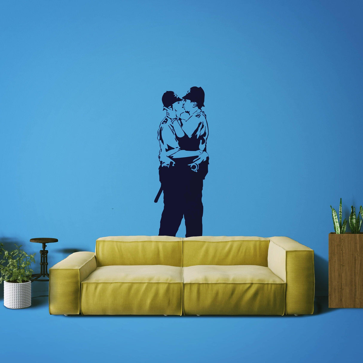 Urban art wall decal of police officers kissing on blue wall, adding bold decor to contemporary living space.