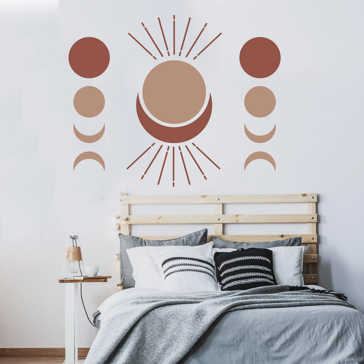 Bohemian crescent and moon phases wall art decal above a stylish bed, perfect for decor inspiration.