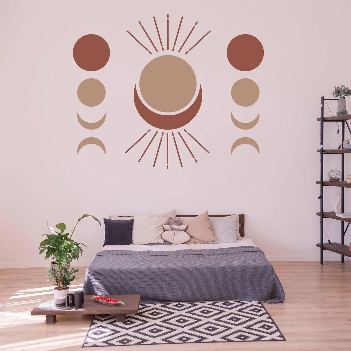 Bohemian crescent and moon phases wall art decal in a cozy bedroom setting with plants and modern decor.