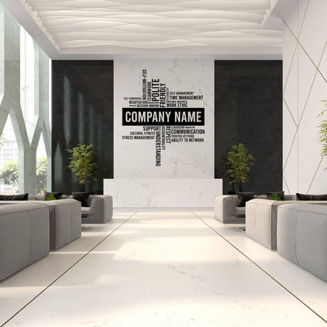 Modern office space featuring a custom wall decal with business name and motivational keywords.
