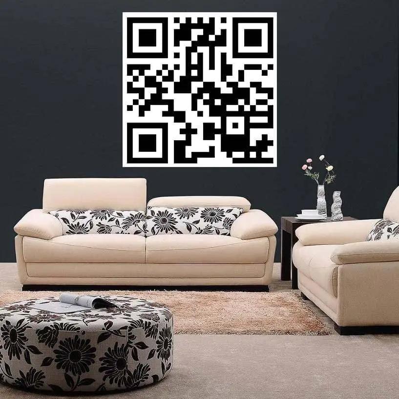 Custom QR code decal on wall above stylish white sofas in modern living room, perfect for personalization and easy scanning.