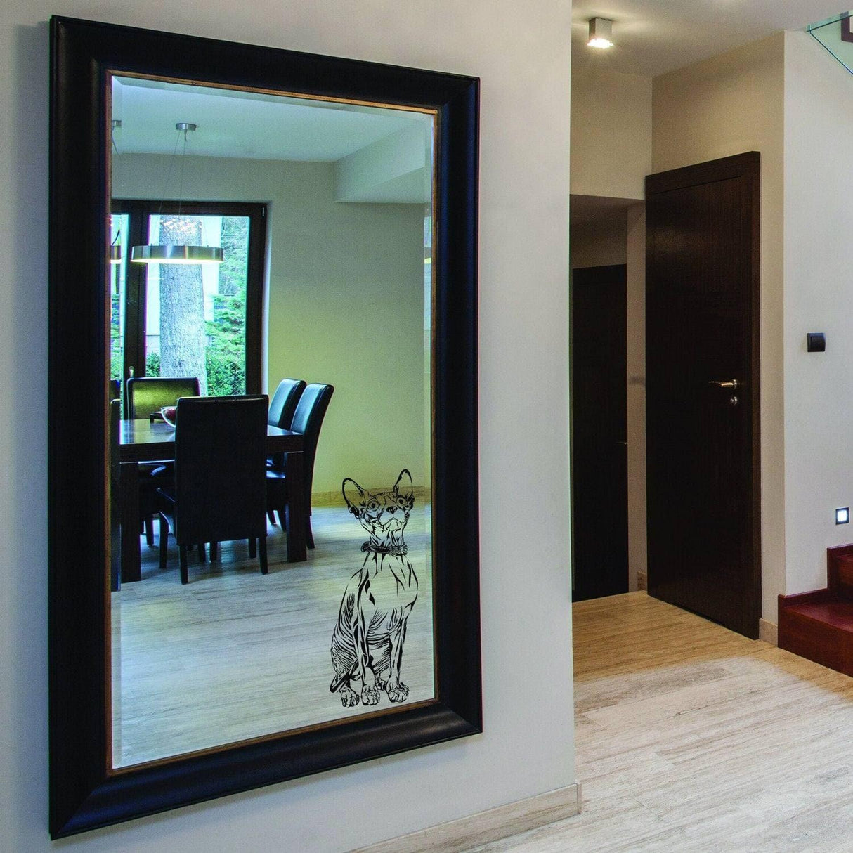 Custom pet artwork wall sticker of a cat on a large mirror in a modern living room setting.