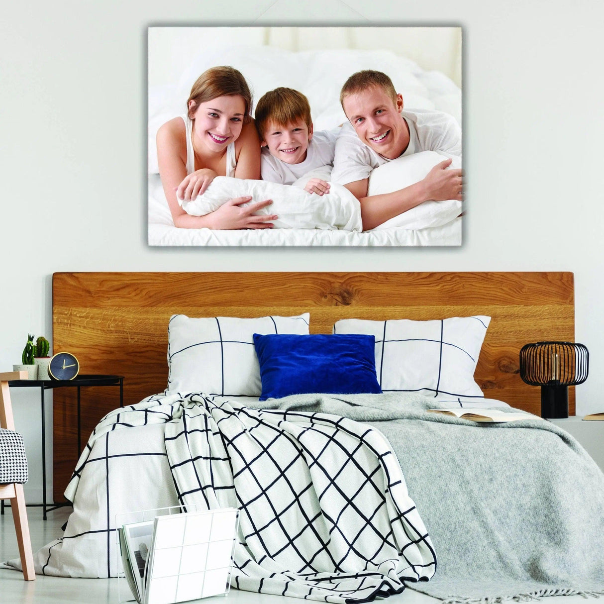 Customized canvas print showcasing a happy family with children in a cozy bedroom setting.