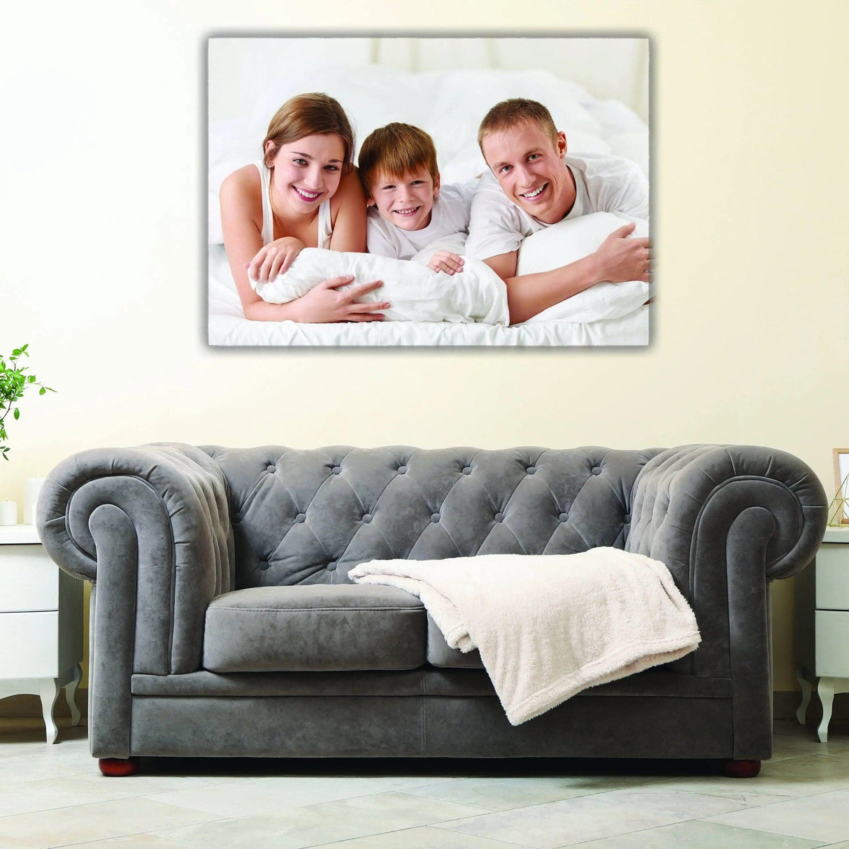 Customized canvas print of a happy family on a stylish living room wall.