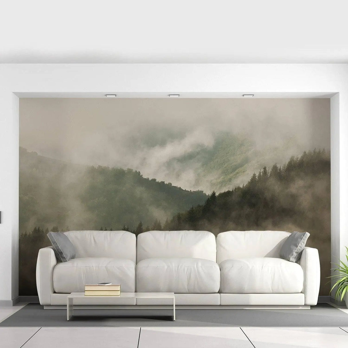 Elegant misty forest landscape wallpaper mural above a modern white sofa in a bright living room.