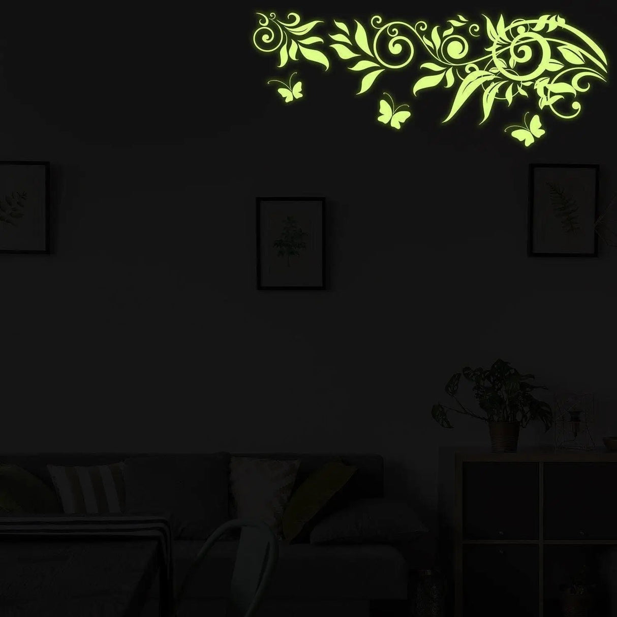 Luminous Blossom Night Wall Sticker illuminating a cozy living room with floral design and butterflies.