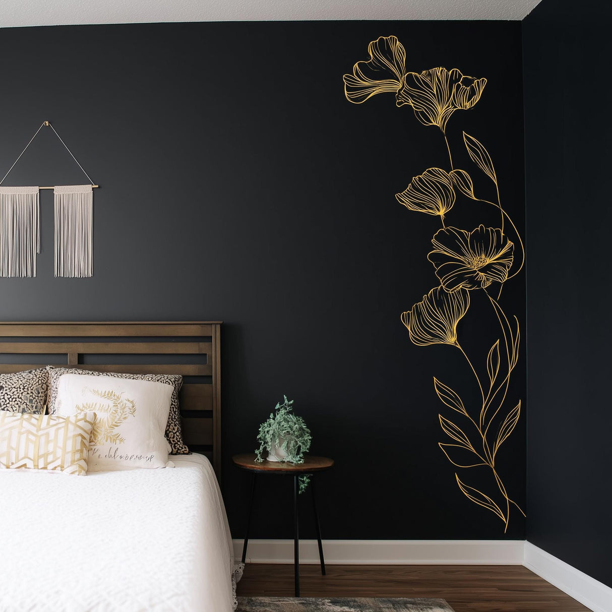 Gold botanical wall decal in a black bedroom, adding elegance and charm to the space.