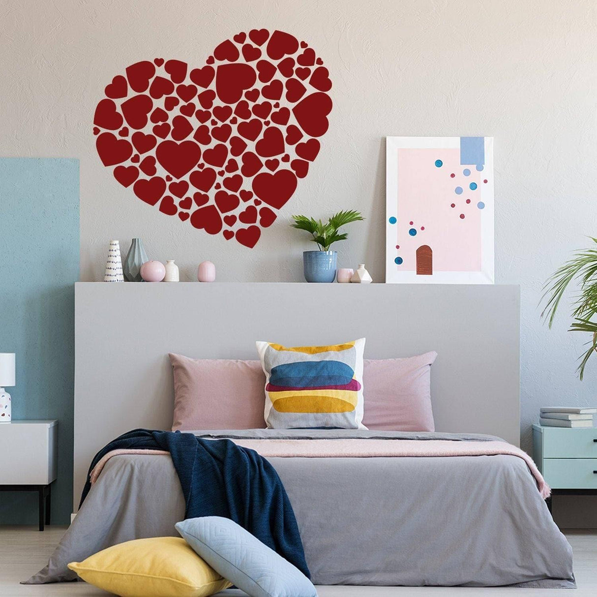 Heart-shaped vinyl sticker collection as wall art in a modern bedroom setting.