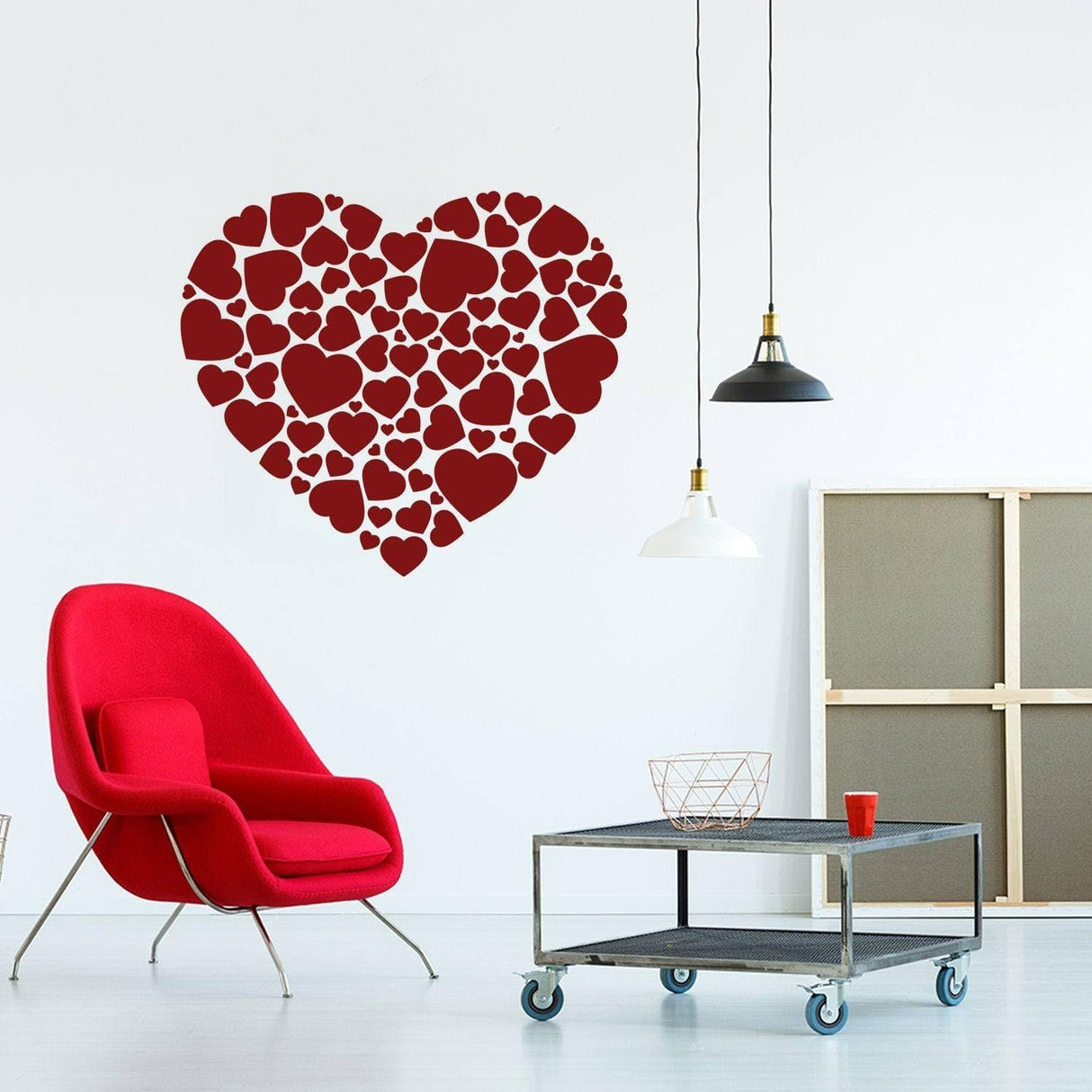 Creative heart-shaped wall decal made of various red hearts, adding romantic decor to a modern living space.