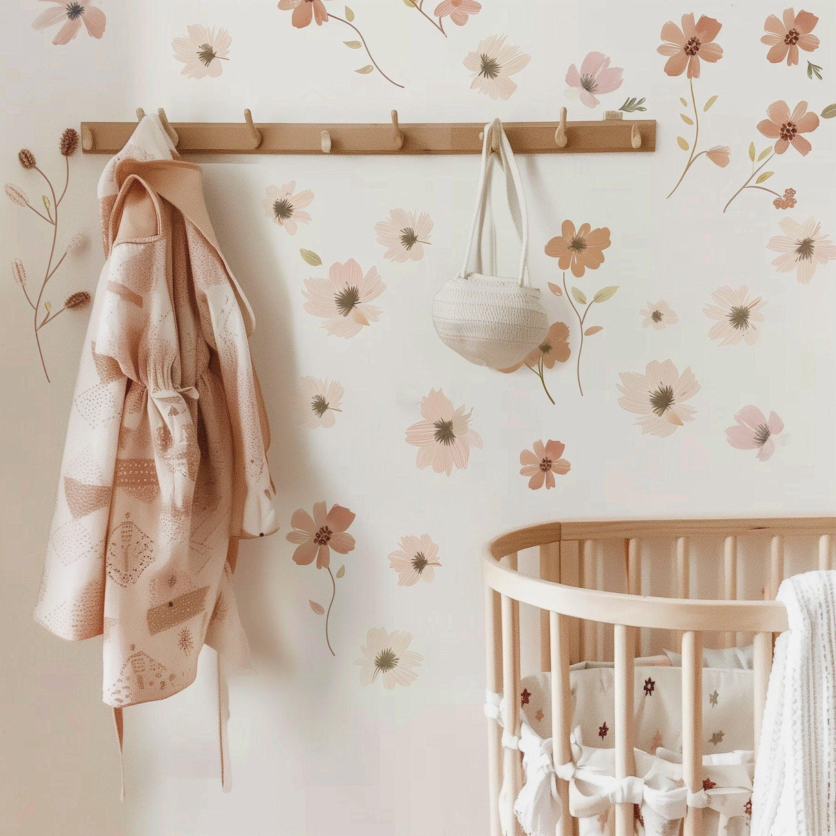 Boho nursery floral wall decals featuring soft pastel flowers, adding charm to a stylish baby's room with a crib and decor.