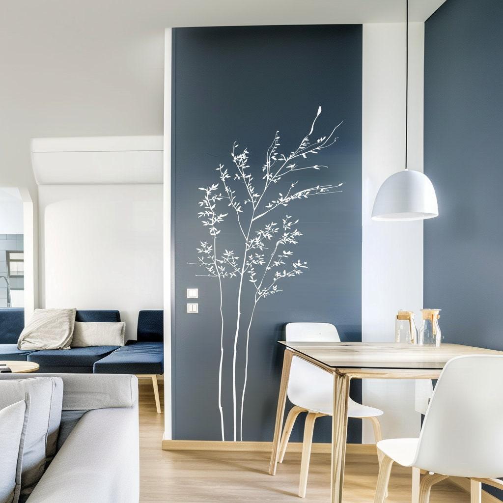 Minimalist white branch wall sticker decal enhancing a modern living room with serene nature-inspired decor.