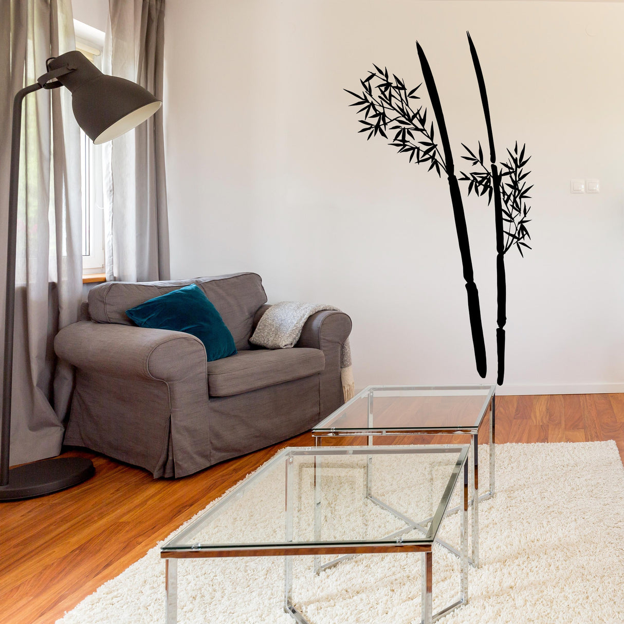 Minimalist bamboo wall decal in a modern living room, enhancing the tranquil decor with nature-inspired design.