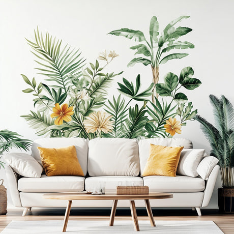 Botanical wall decal with tropical leaves and flowers above a white sofa, adding nature-inspired decor to the living room.