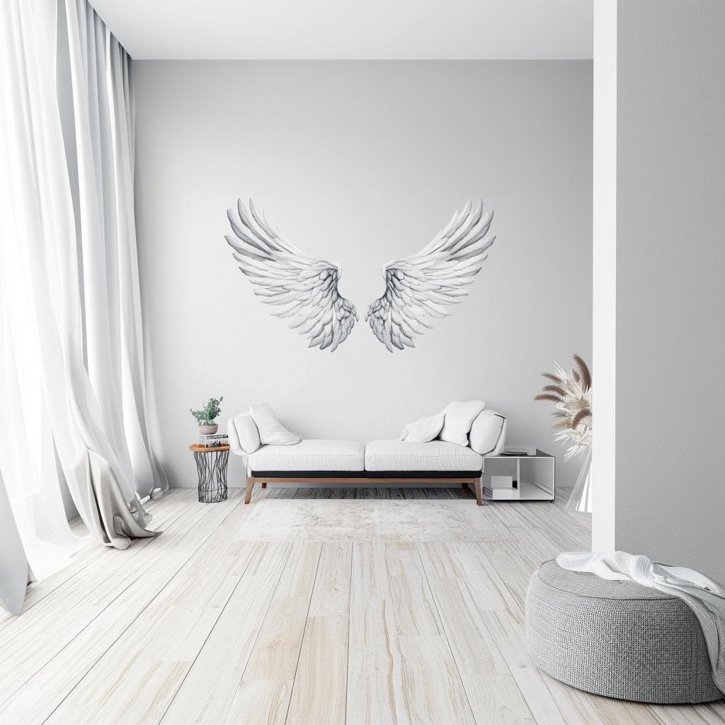 Large angel wings wall decal in a serene living room setting, adding elegance to the minimalist decor.