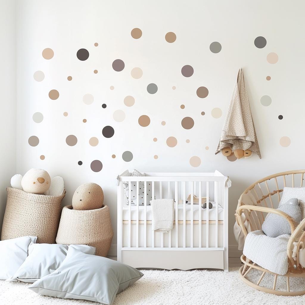 Neutral beige and grey circle wall decals above a crib in a soothing nursery setting, featuring soft decor and toys.