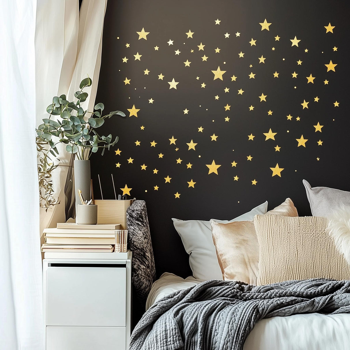 Gold stars wall decals on a dark wall above a cozy bed, creating a celestial and modern bedroom atmosphere.