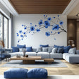 Blue flower branch wall decal in a modern living room, featuring elegant blue blooms on a flowing branch.