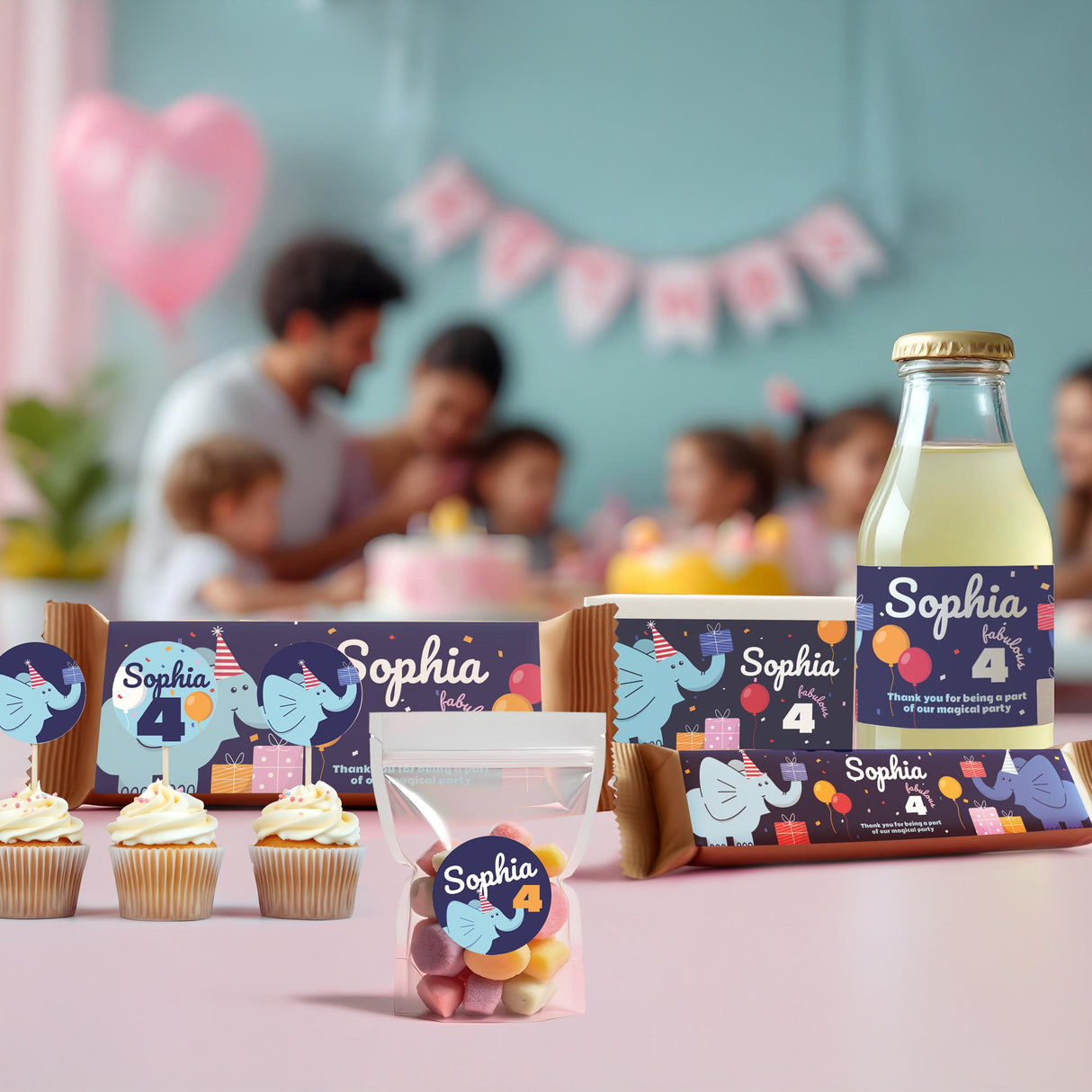 Personalized elephant birthday party decorations featuring custom decals for cupcakes, bottles, and favor boxes for Sophia's 4th birthday.