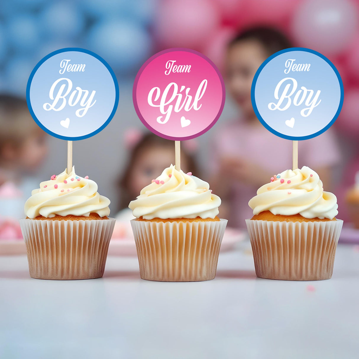 Ice cream themed cupcakes with 'Team Boy' and 'Team Girl' toppers for gender reveal party decorations.