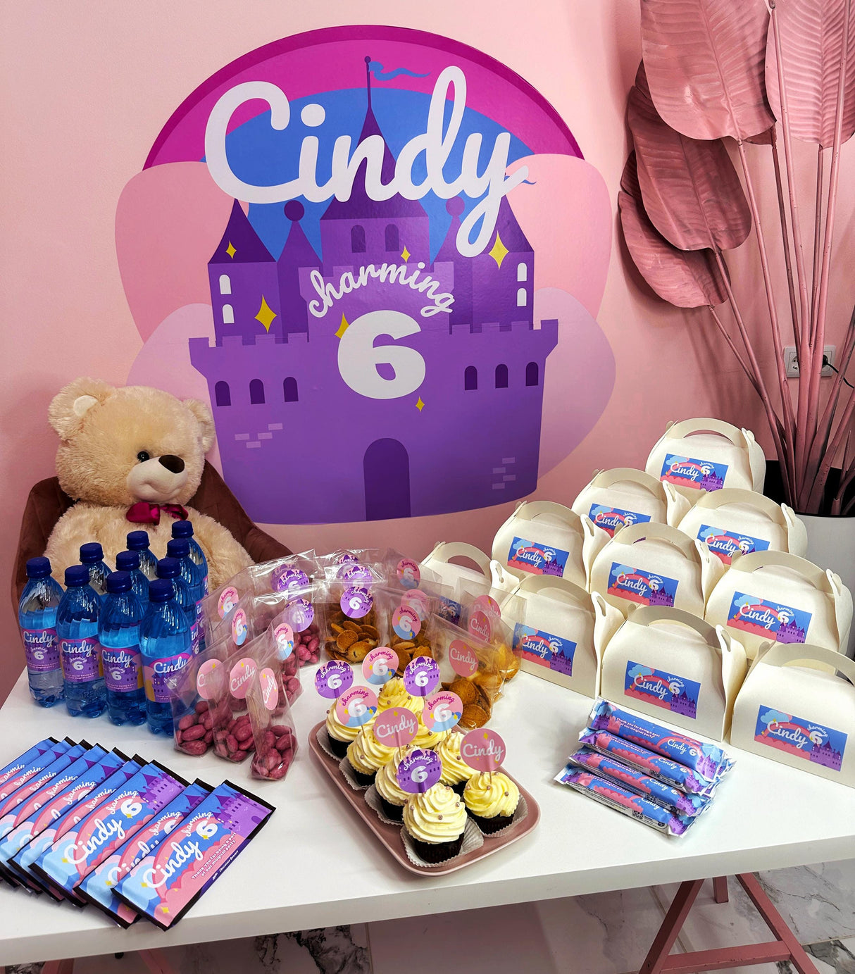 Personalized birthday party setup with custom decorations and treats for a child, featuring Cindy's 6th birthday theme.