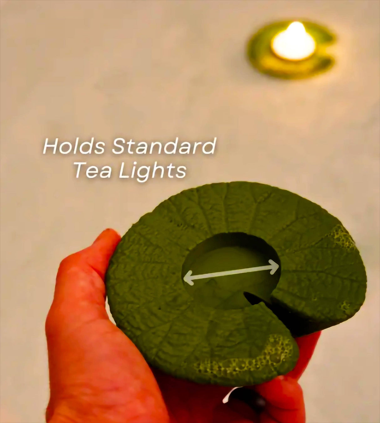 CandleLily tea light holder in hand, designed for standard tea lights, perfect for relaxing bath ambiance.