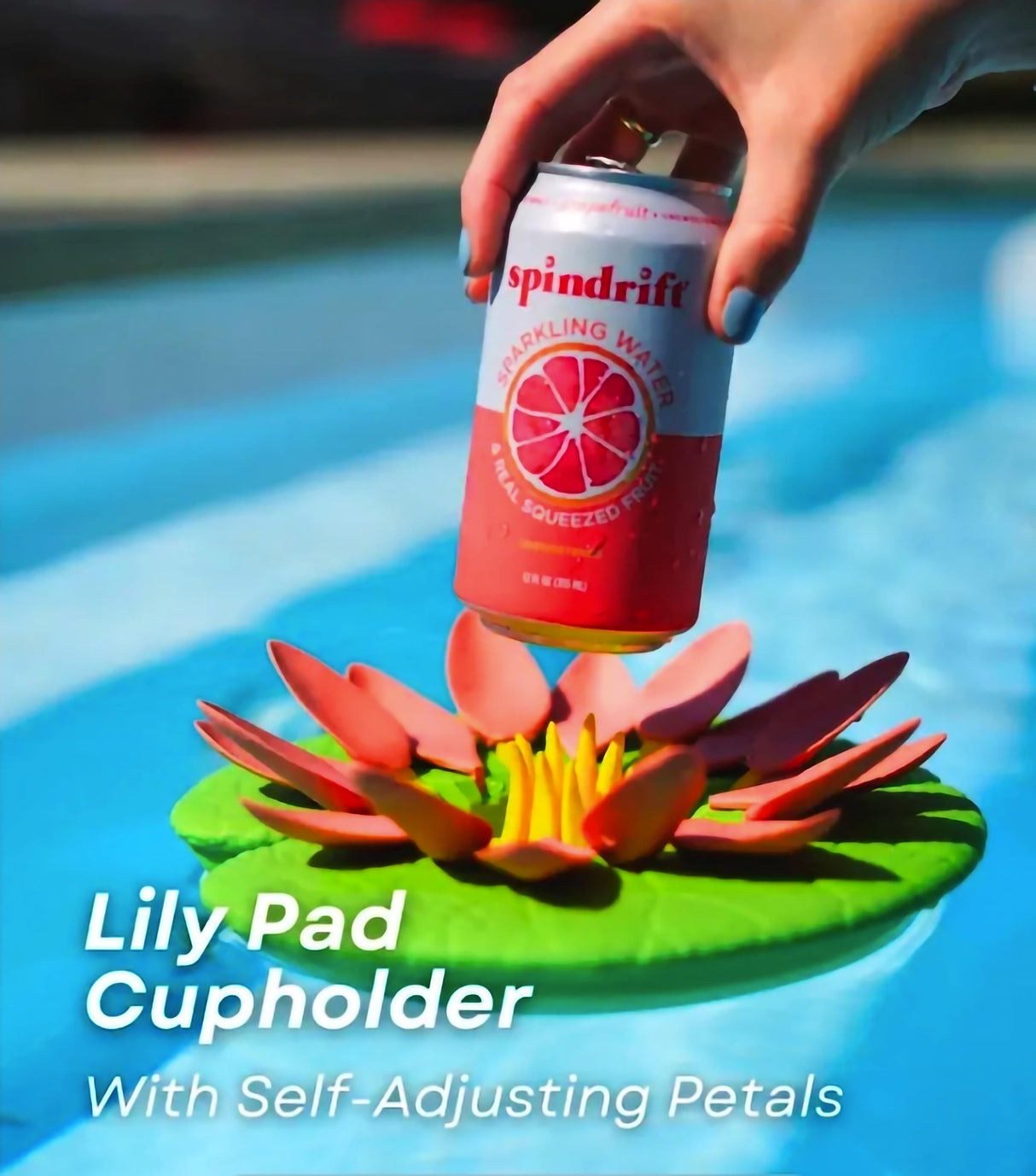 Lily Pad cupholder floating in pool, holding a can with self-adjusting petals for stability.