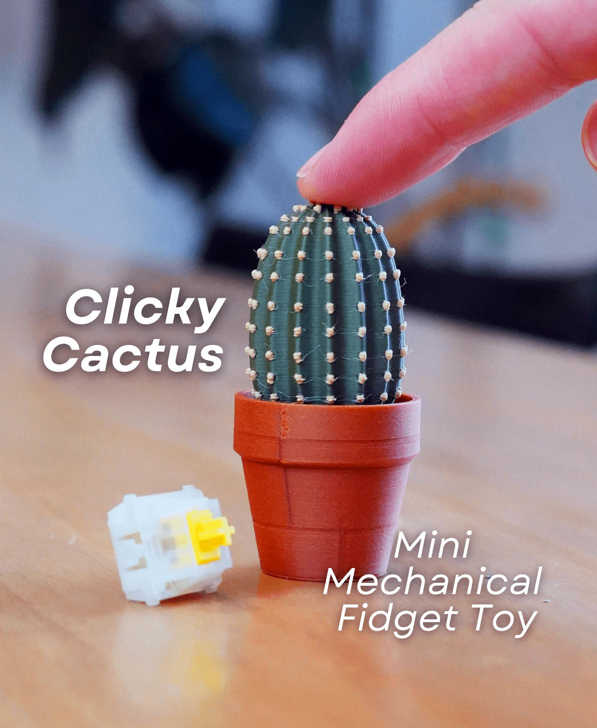 Mini Clickable Cactus fidget toy in a pot, perfect for desk decor and stress relief, hand pressing for tactile feedback.