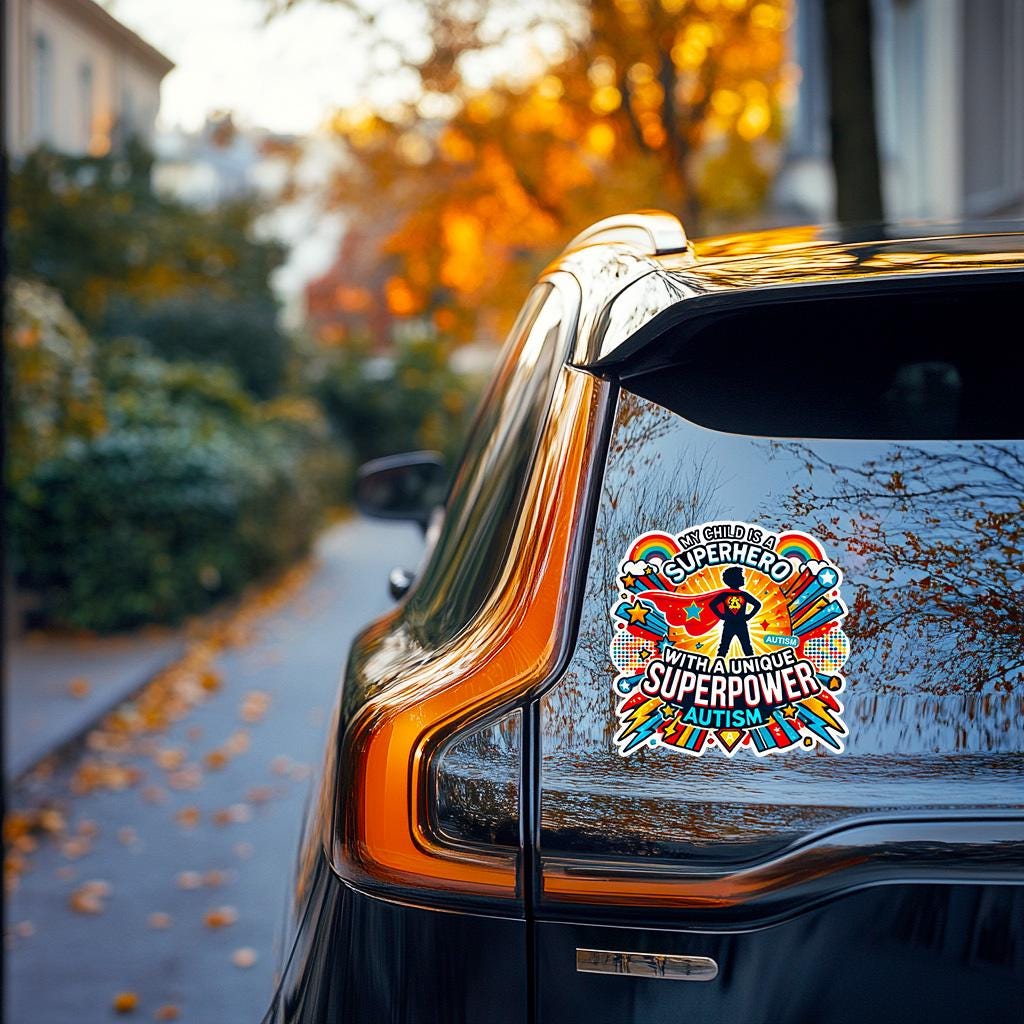 Vinyl autism awareness sticker on car window, featuring superhero design and bright colors, promoting positivity.