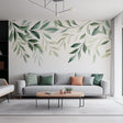 Leaf wall decal with watercolor greenery design above a cozy living room sofa, enhancing natural decor.