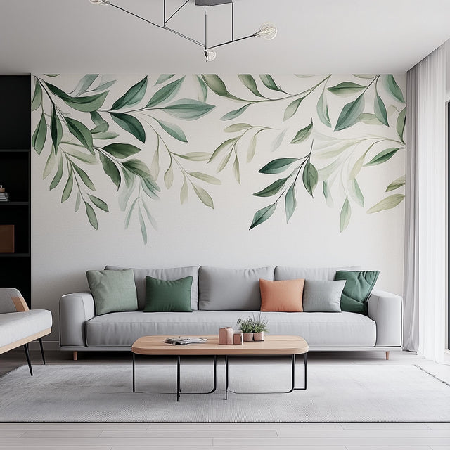 Leaf wall decal with watercolor greenery design above a cozy living room sofa, enhancing natural decor.