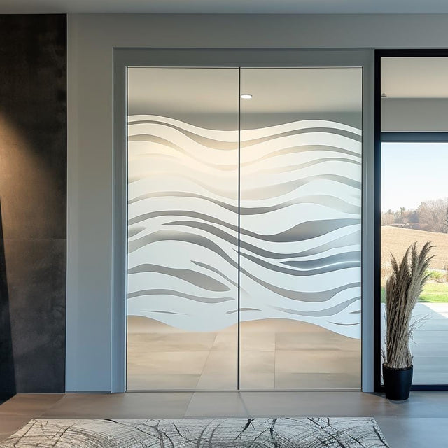 Frosted glass decal with elegant wave design on sliding doors, enhancing privacy and style in a modern space.