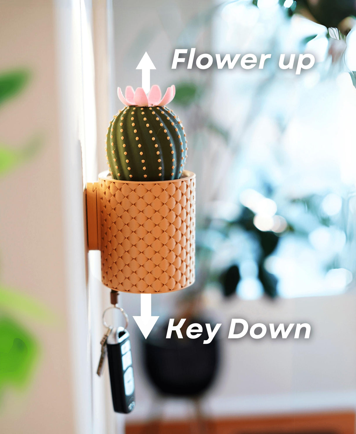 Blooming wall-mounted key holder with cactus design, showcasing key storage and decorative flower feature.