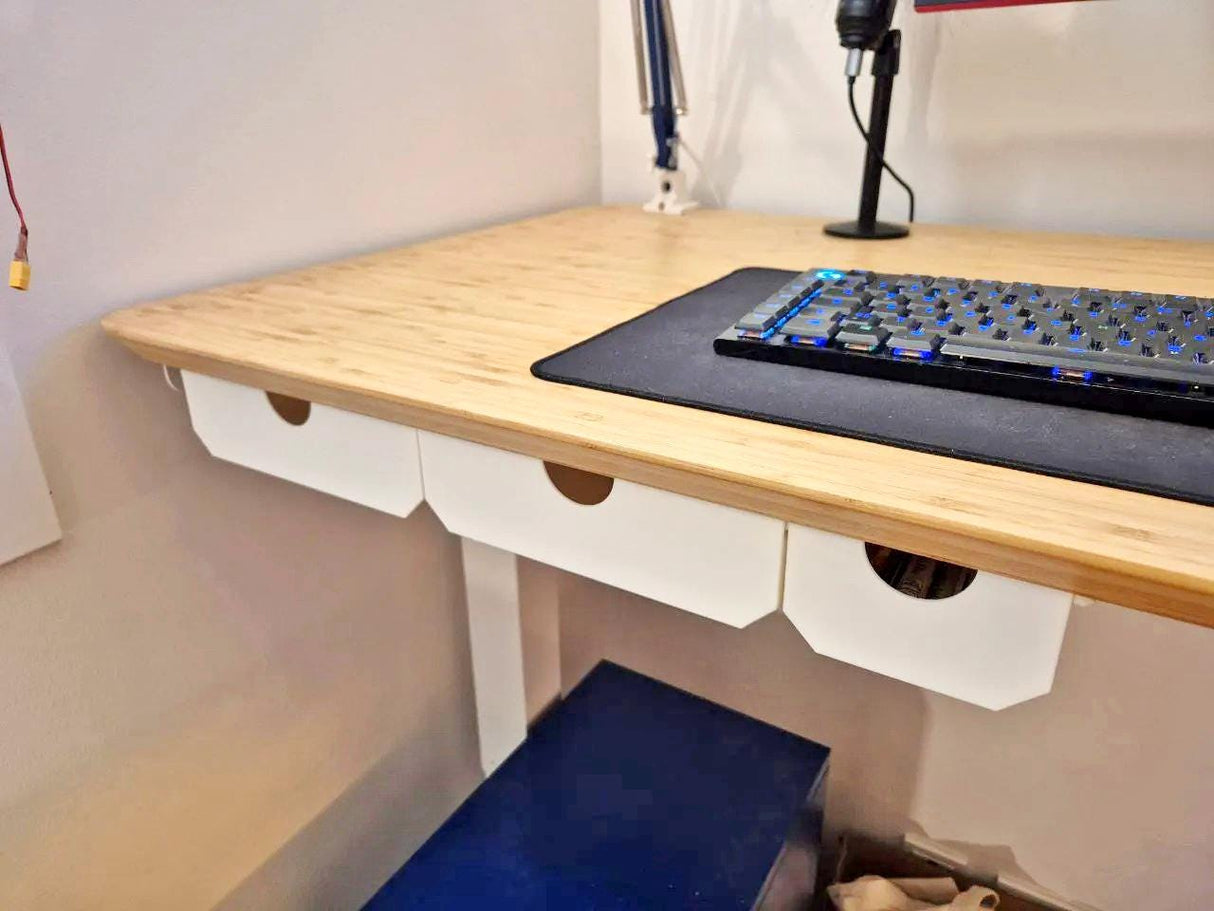 Under desk drawer organizer with hidden storage, minimalist design, and computer keyboard on a bamboo desk.