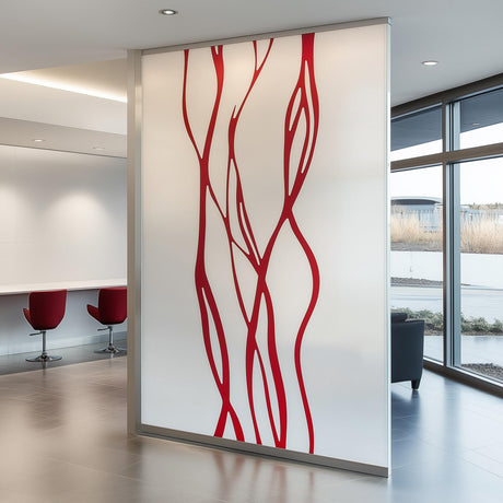 Abstract line frosted glass sticker with red design on a translucent partition in a modern office setting.