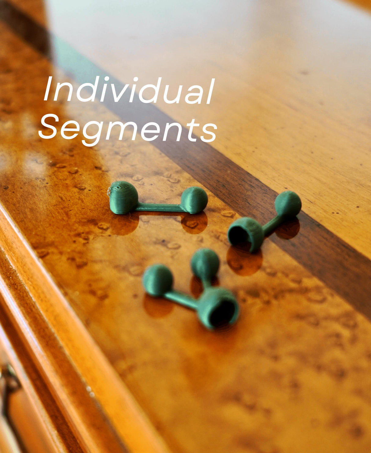 Individual green segments for the customizable String of Pearls 3D printed succulent decor.