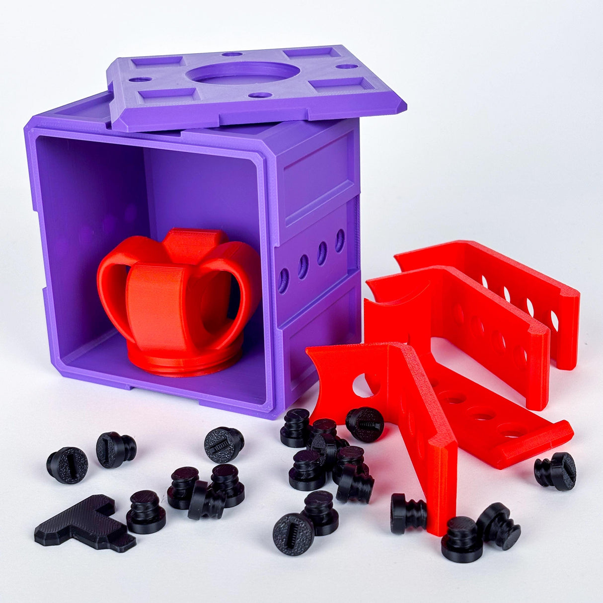 Colorful 3D-printed annoying gift box with red puzzle piece and bolts, perfect for a fun challenge and gag gift.
