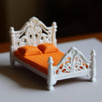 French-style miniature double bed with orange bedding in 1:12 scale for dollhouse decor.