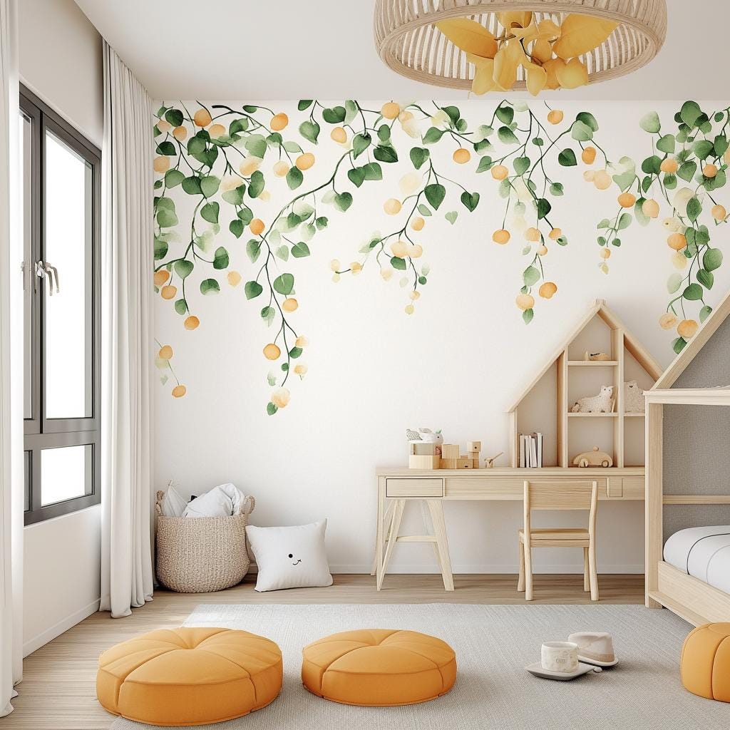 Watercolor citrus wall decal with orange fruits and green leaves in a bright nursery, featuring a cozy play area.