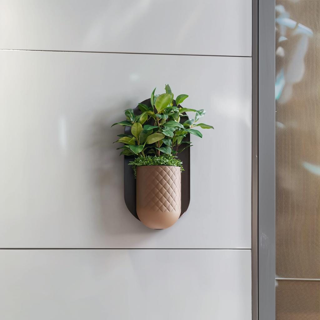 Modern minimalist wall planter with green plants mounted on a sleek wall, featuring a textured geometric design.