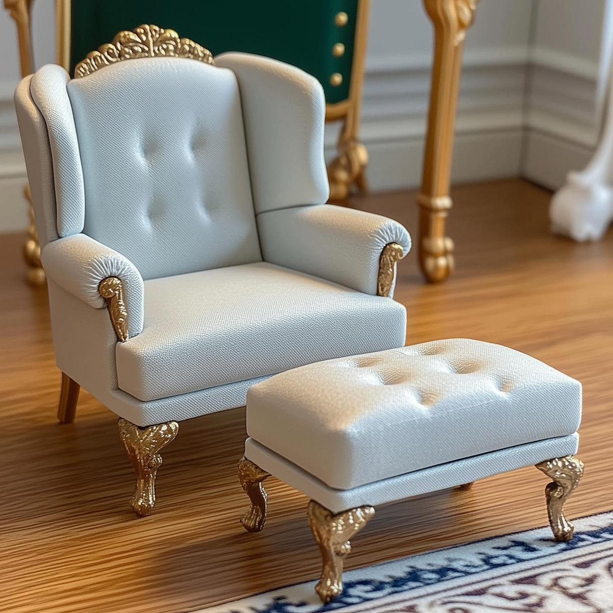Elegant white dollhouse armchair and ottoman set with golden legs and tufted cushions in Victorian style.