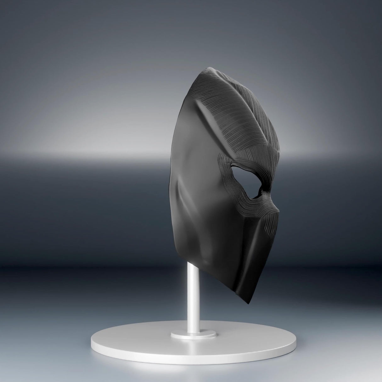 Futuristic tactical black face mask displayed on a stand, showcasing intricate 3D printed design and modern aesthetic.